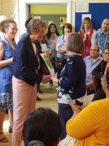 Learner receiving certificate at MAES celebration event 2019