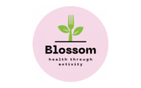 Logo: Blossom Manchester, pink circle with green weed growing from the ground